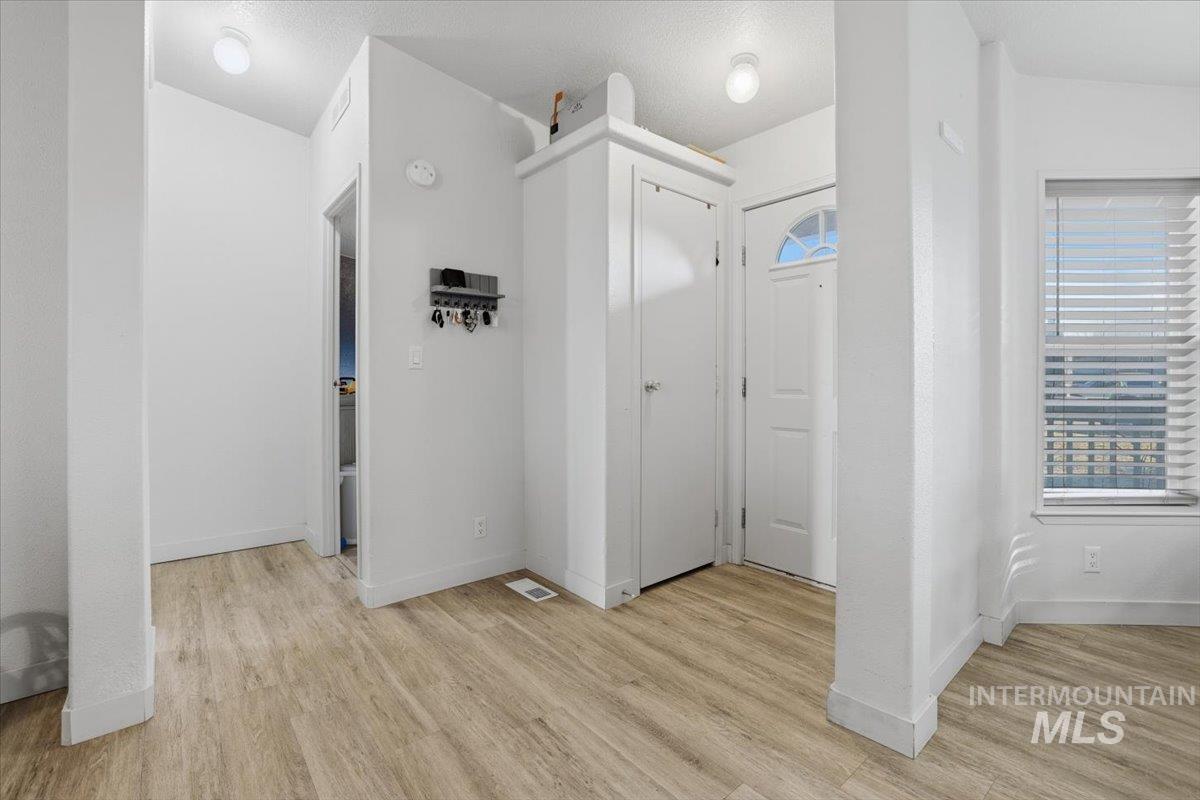 545 South Conover Street Eagle, ID 83616 - Photo 5 of 39 Hall featuring light wood-style flooring