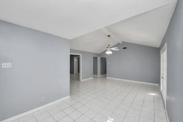 a bathroom with a granite countertop toilet a sink and a mirror