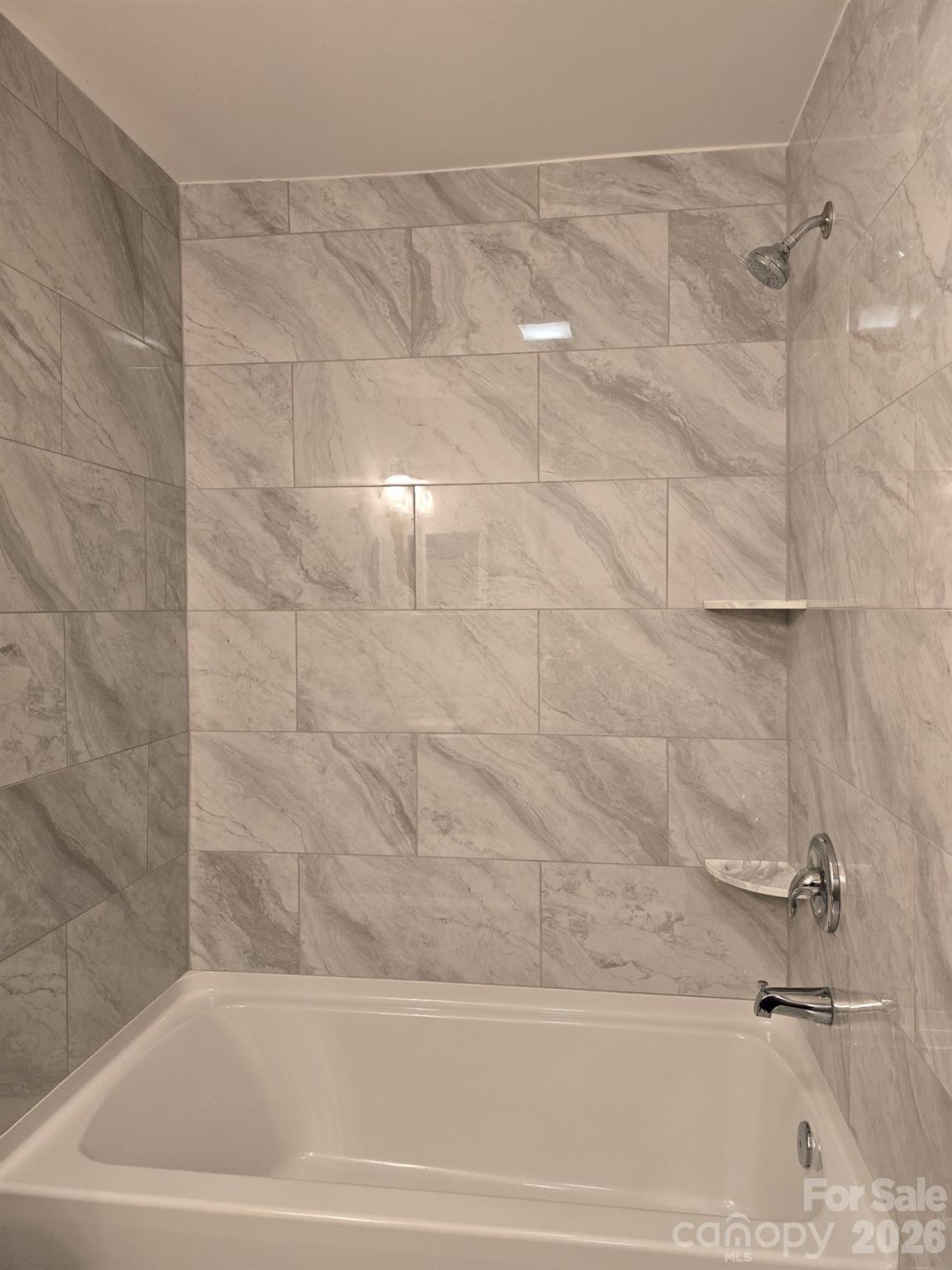 126 Sunset Drive Chester, SC 29706 - Photo 14 of 31 a bathroom with a bathtub and a shower