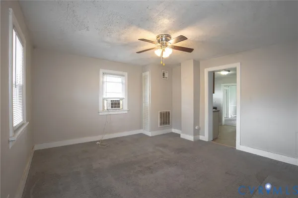a view of an empty room with a window