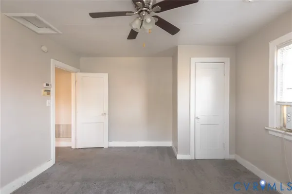 a view of an empty room and window