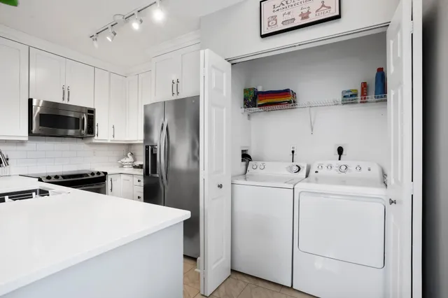 a utility room with dryer and washer