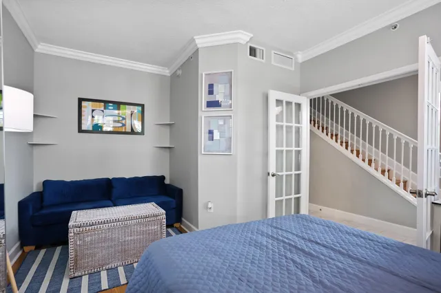 a bedroom with furniture and a window