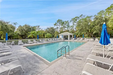 a view of a swimming pool with a patio