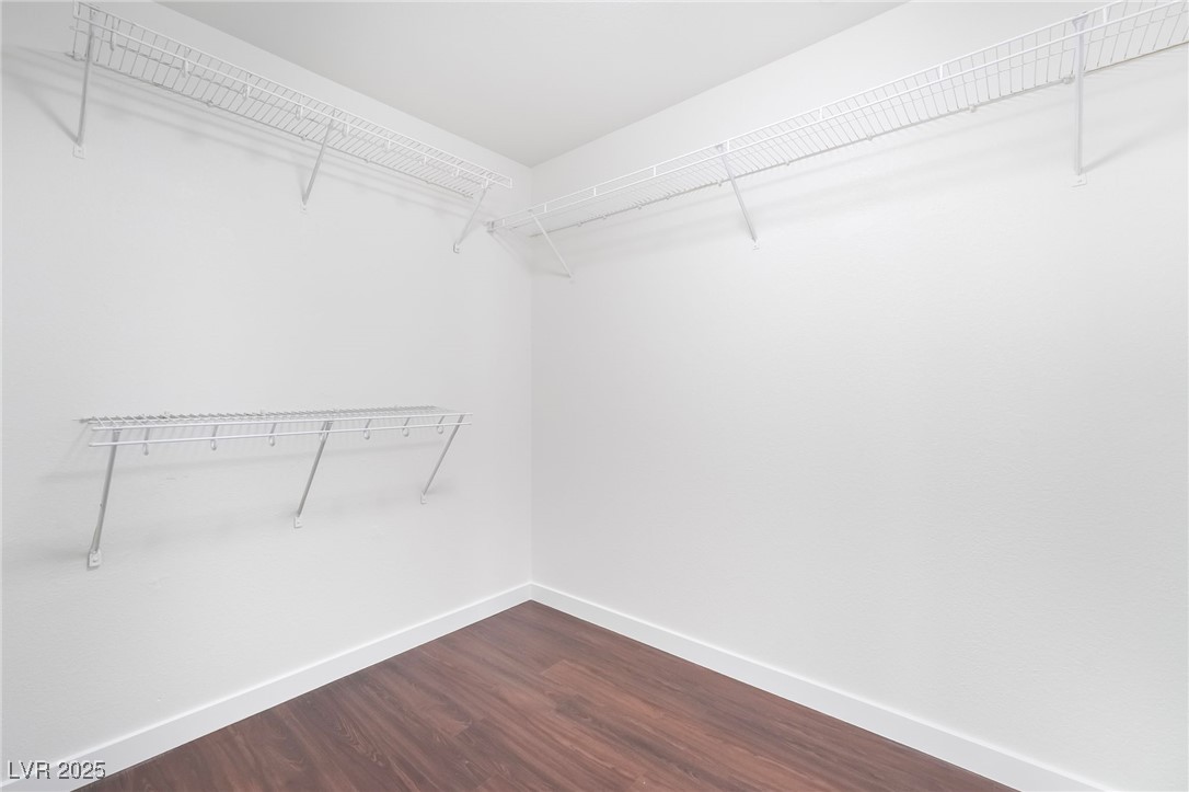 3052 Camino Rico Avenue Henderson, NV 89044 - Photo 26 of 39 Spacious closet with dark wood finished floors