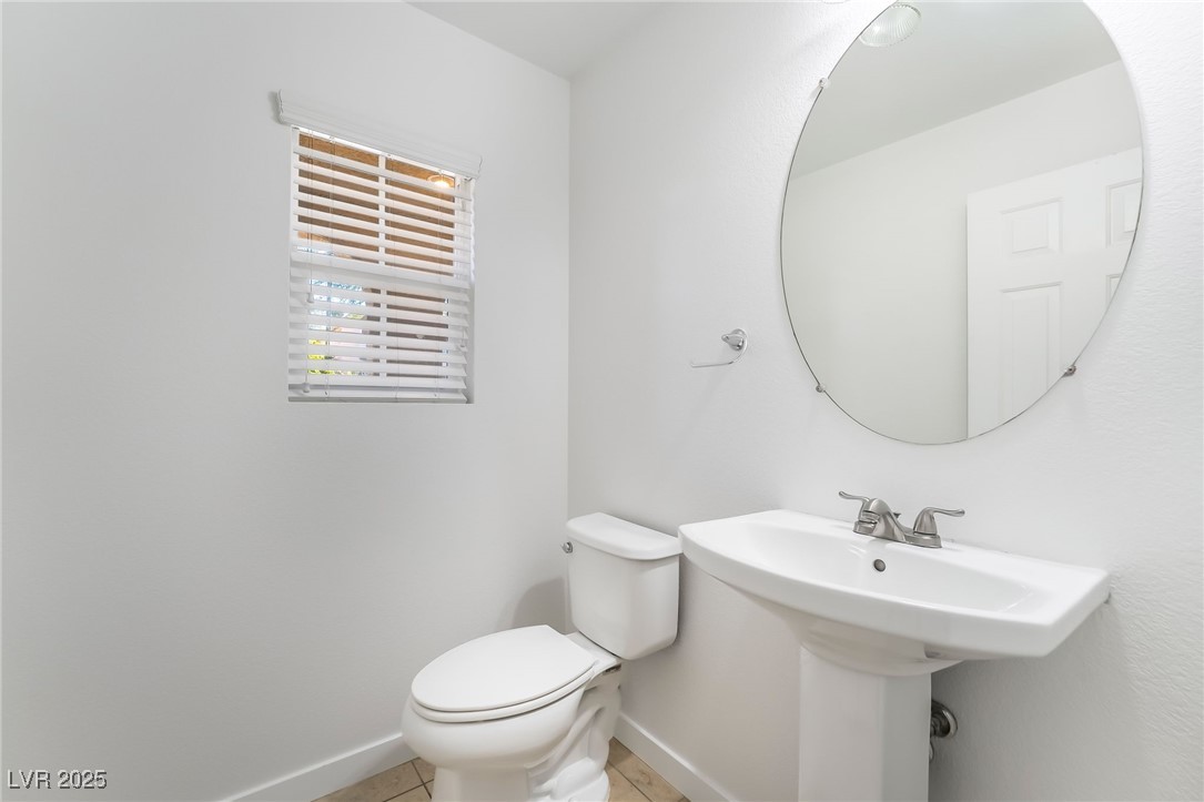 3052 Camino Rico Avenue Henderson, NV 89044 - Photo 8 of 39 Half bathroom with baseboards and light tile patterned floors