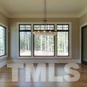 10605 Marion Stone Way Raleigh, NC 27614 - Photo 11 of 22 a view of an empty room with a window