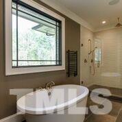 10605 Marion Stone Way Raleigh, NC 27614 - Photo 17 of 22 a bath tub sitting next to a window