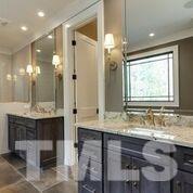 10605 Marion Stone Way Raleigh, NC 27614 - Photo 18 of 22 a bathroom with a sink double vanity and a mirror