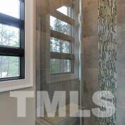 10605 Marion Stone Way Raleigh, NC 27614 - Photo 19 of 22 a bathroom with a toilet and a shower