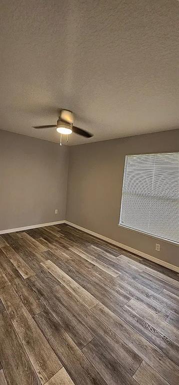 7502 Waunaqua Drive Winter Park, FL 32792 - Photo 5 of 7 a view of a room with wooden floor and white walls
