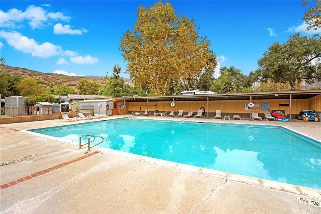 1631 Harbison Canyon Road, Unit 24 El Cajon, CA 92019 - Photo 17 of 33 a view of a swimming pool with a yard