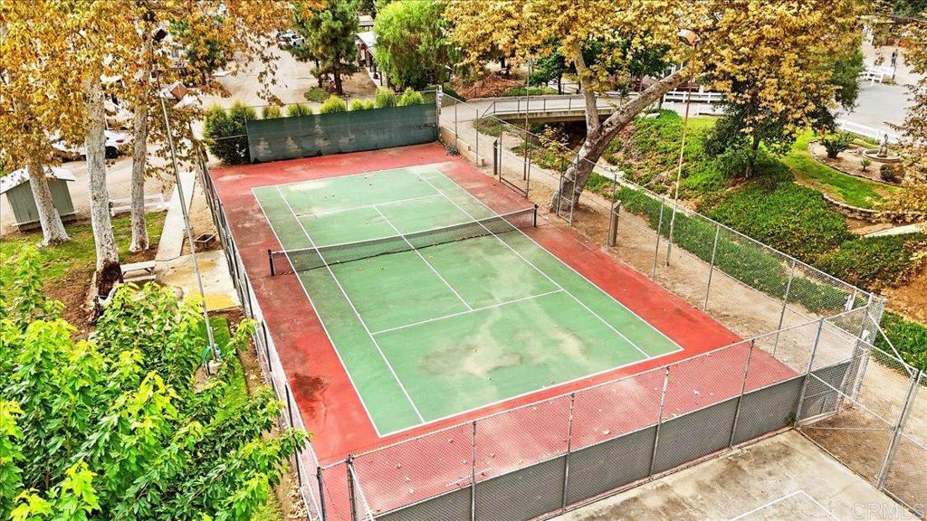 1631 Harbison Canyon Road, Unit 24 El Cajon, CA 92019 - Photo 19 of 33 a view of a tennis ground with large trees