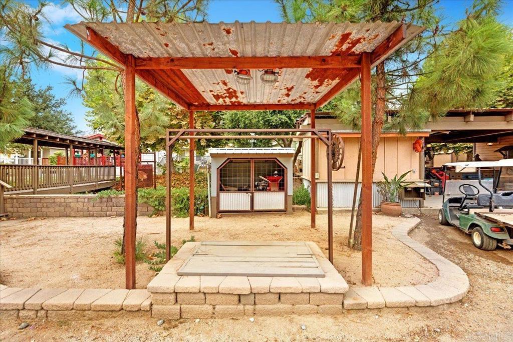1631 Harbison Canyon Road, Unit 24 El Cajon, CA 92019 - Photo 23 of 33 a view of a patio with a table and chairs