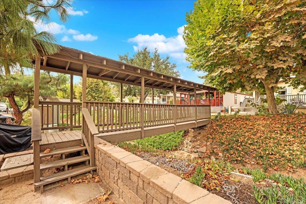 1631 Harbison Canyon Road, Unit 24 El Cajon, CA 92019 - Photo 28 of 33 a view of a chair and table in the backyard