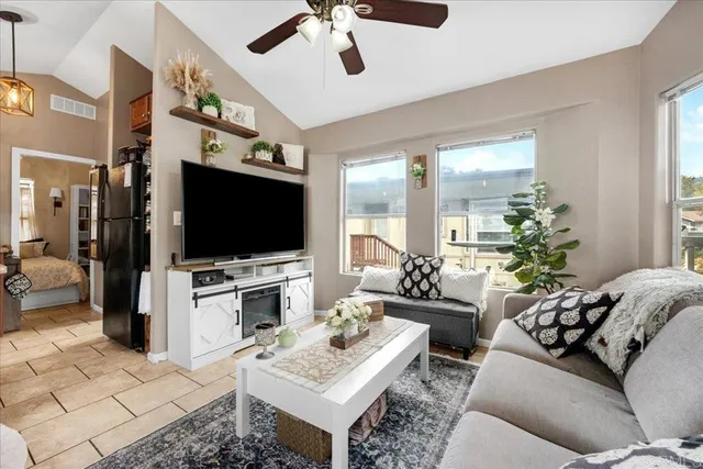 a living room with furniture and a flat screen tv
