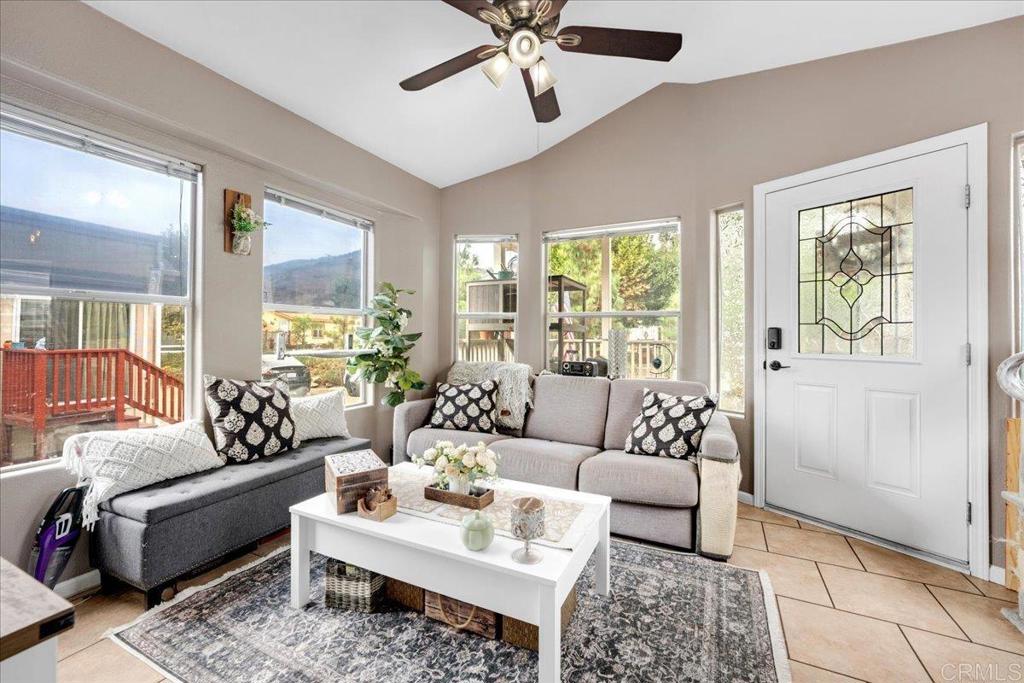1631 Harbison Canyon Road, Unit 24 El Cajon, CA 92019 - Photo 4 of 33 a living room with furniture and a large window