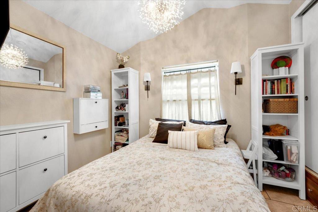 1631 Harbison Canyon Road, Unit 24 El Cajon, CA 92019 - Photo 8 of 33 a bedroom with a large bed and a window