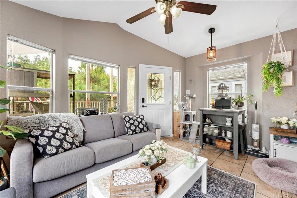 1631 Harbison Canyon Road, Unit 24 El Cajon, CA 92019 - Photo 9 of 33 a living room with furniture and a large window