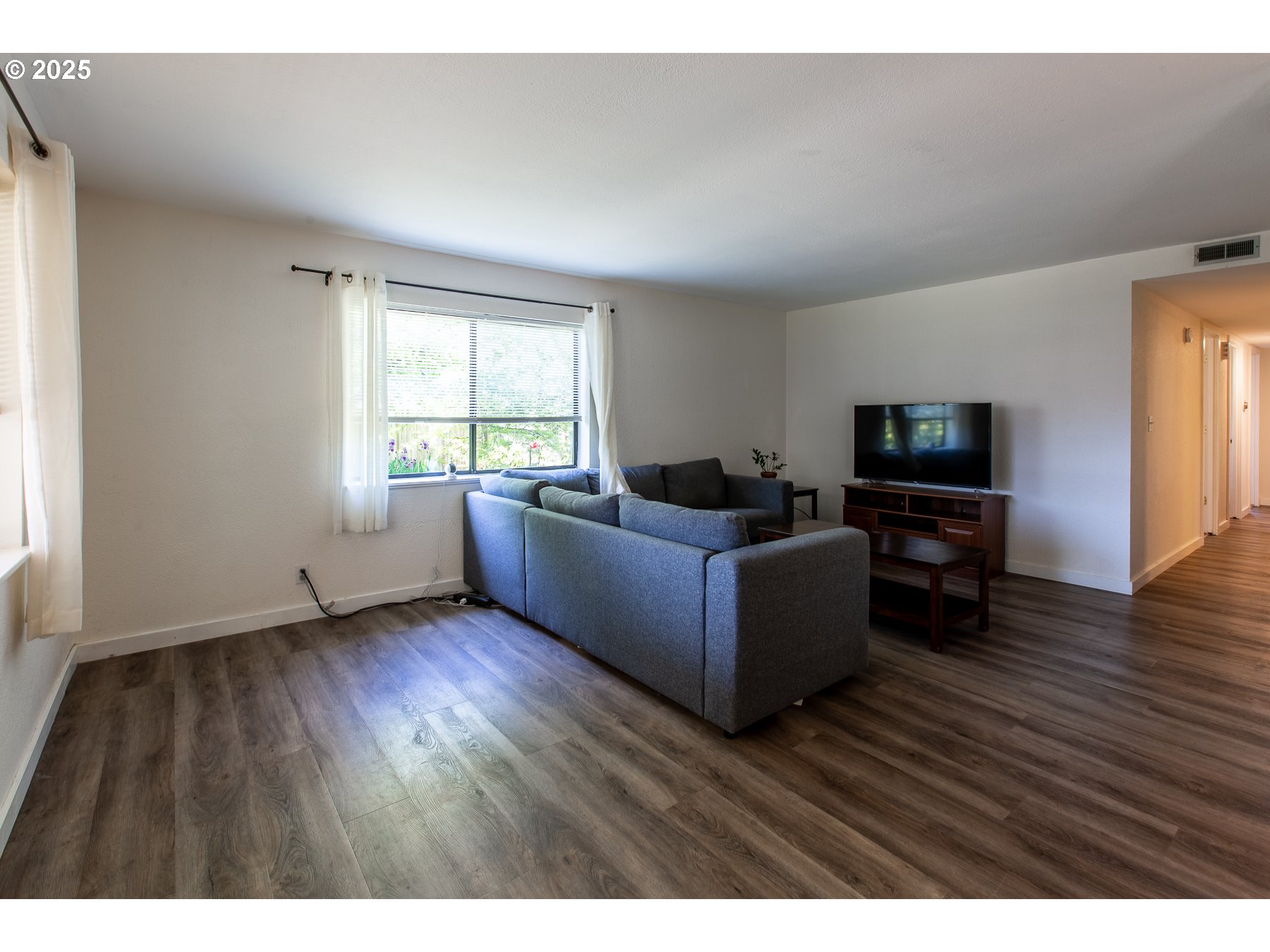 1403 Haven Street Eugene, OR 97402 - Photo 12 of 31 a living room with furniture and a flat screen tv