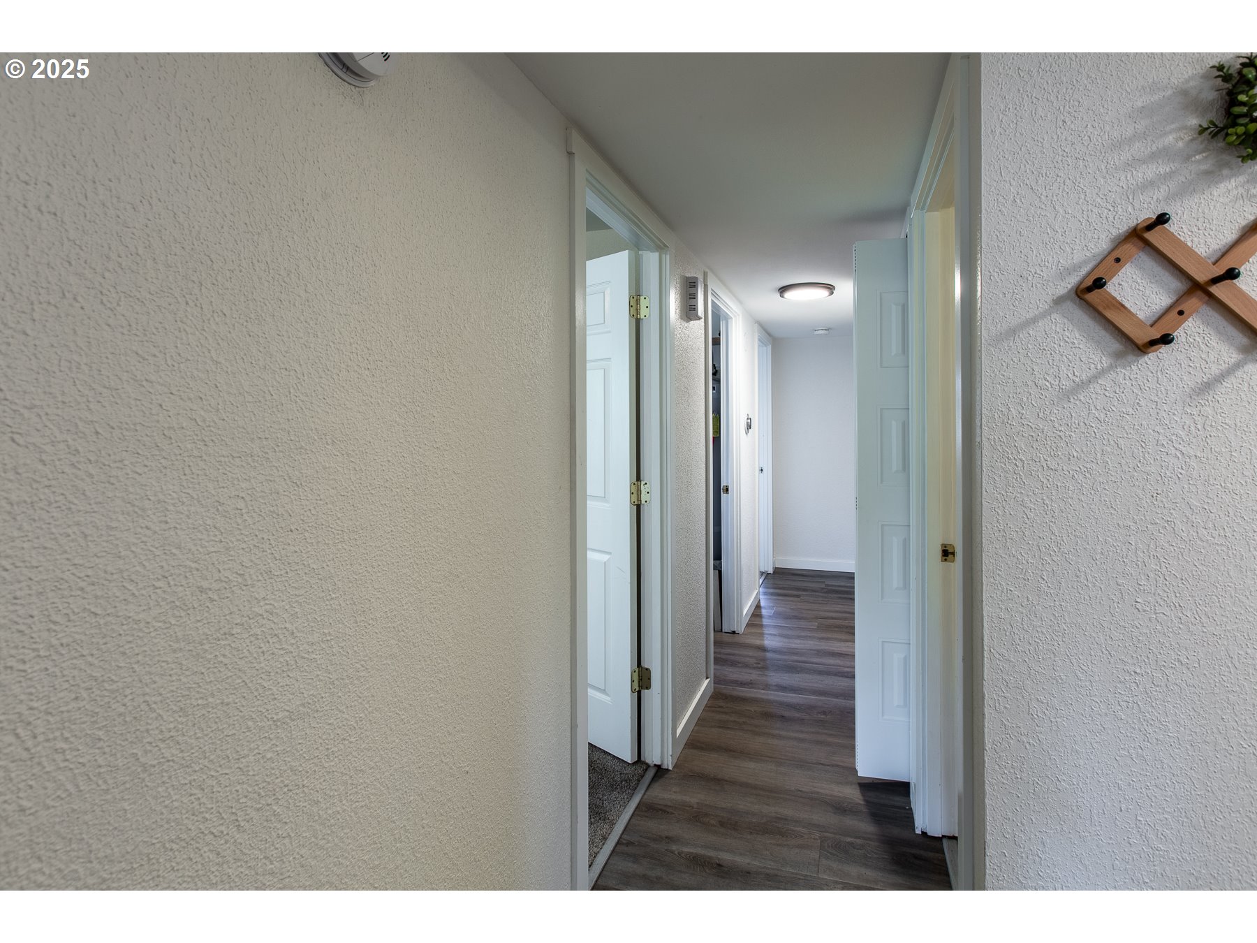 1403 Haven Street Eugene, OR 97402 - Photo 13 of 31 a view of a hallway with wooden floor