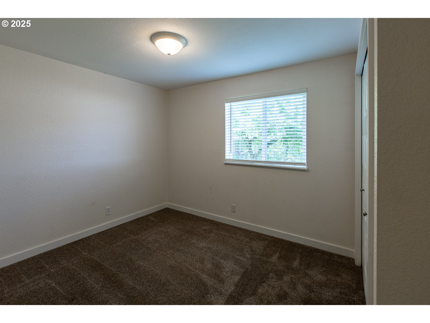 1403 Haven Street Eugene, OR 97402 - Photo 15 of 31 a view of an empty room with a window