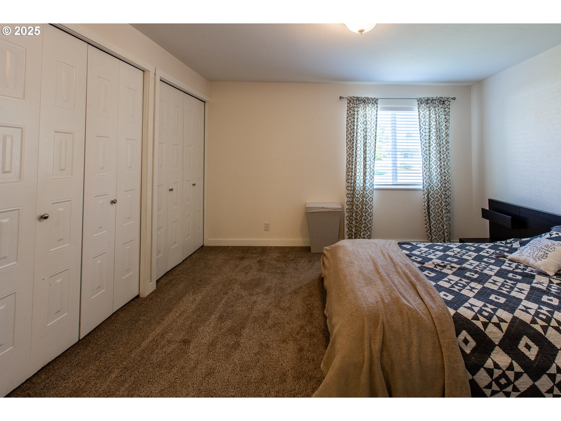 1403 Haven Street Eugene, OR 97402 - Photo 20 of 31 a bedroom with a bed and a window