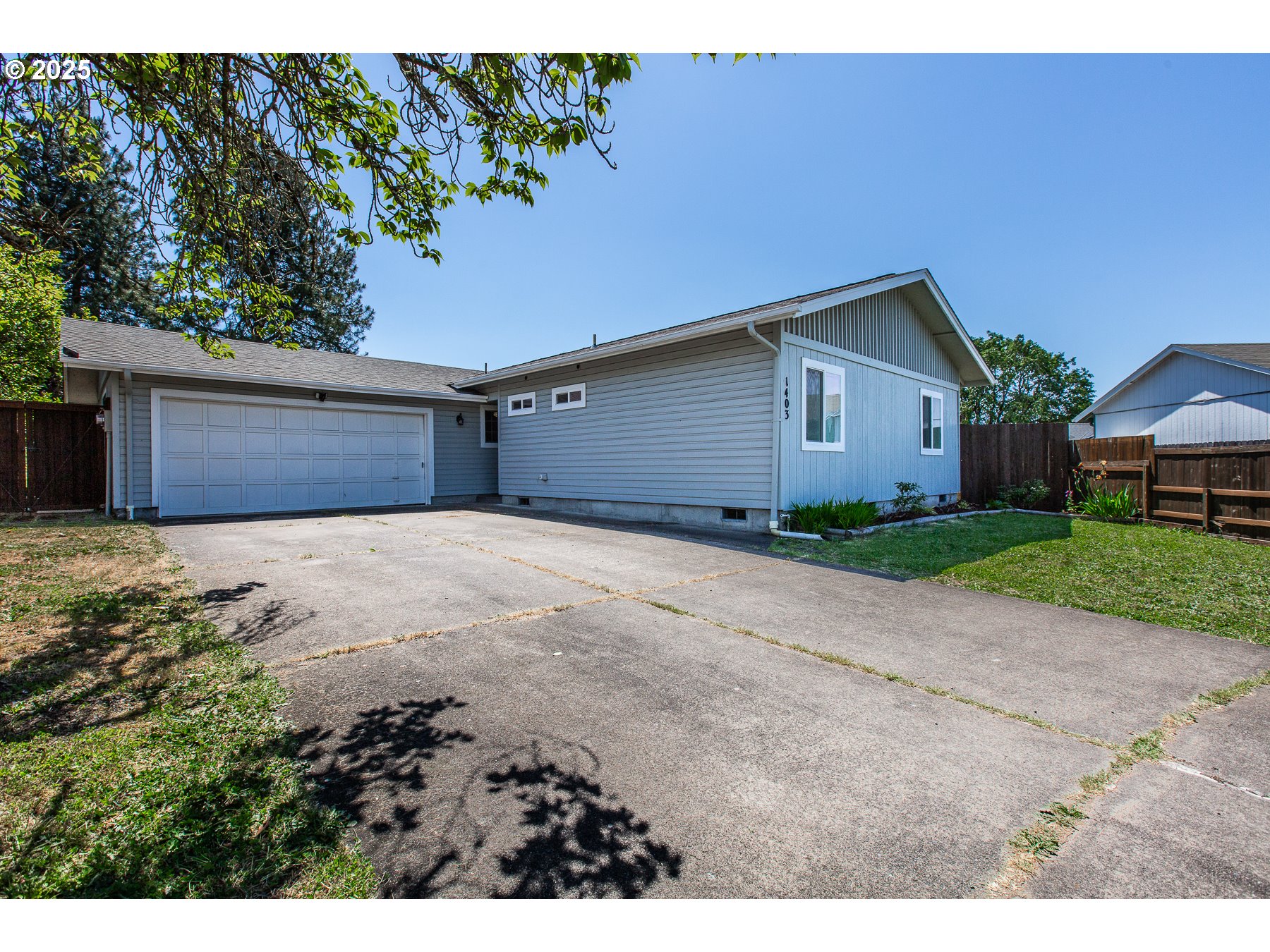 1403 Haven Street Eugene, OR 97402 - Photo 2 of 31 a front view of house with yard and trees in the background