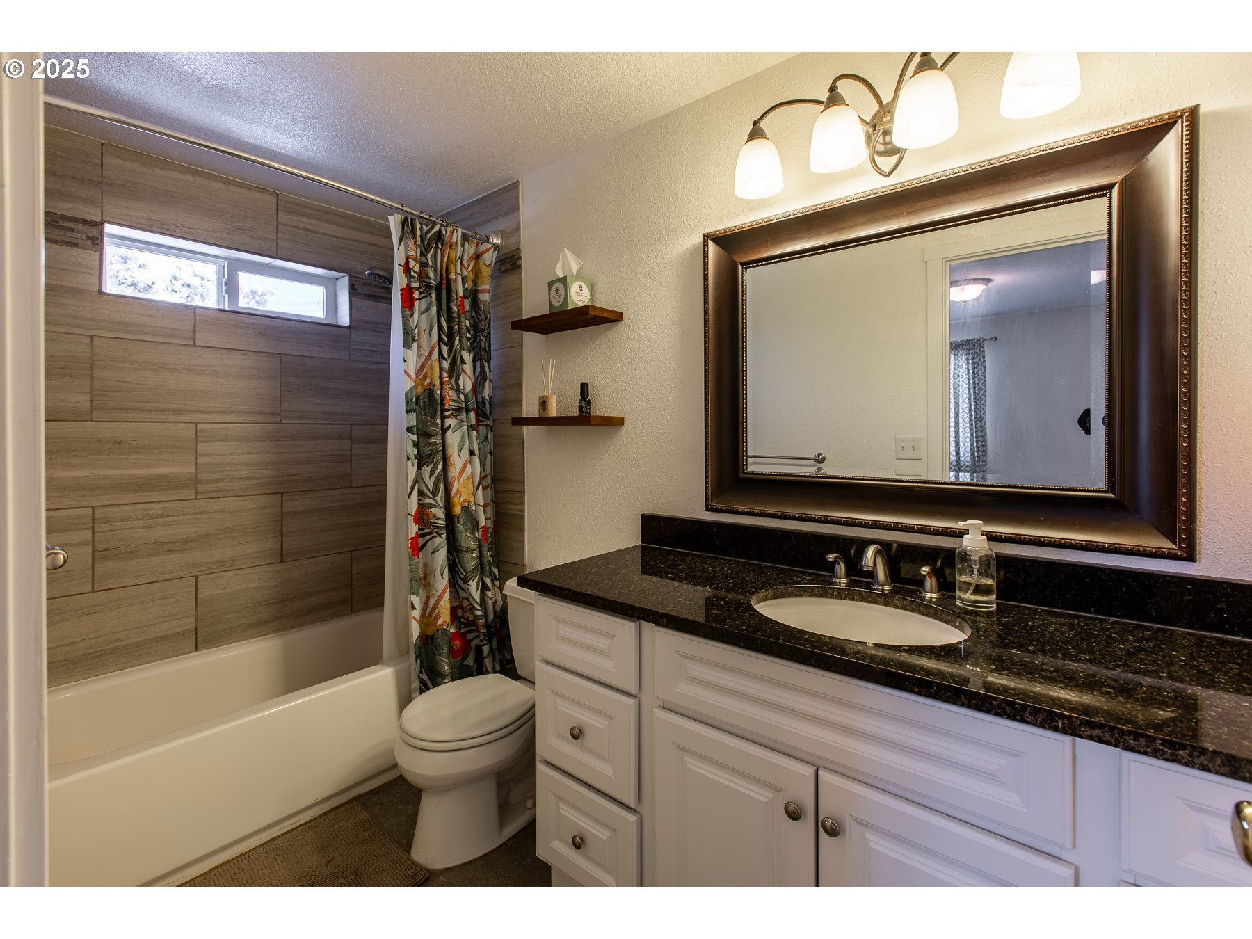 1403 Haven Street Eugene, OR 97402 - Photo 21 of 31 a bathroom with a granite countertop sink toilet and shower