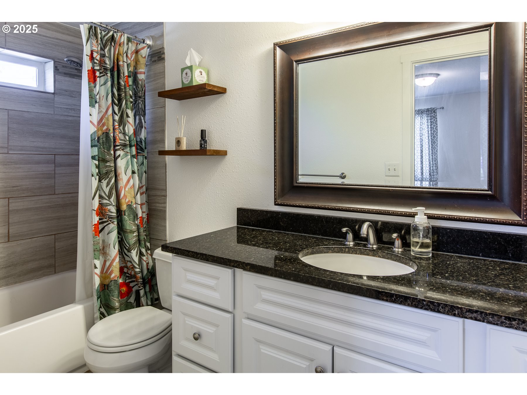 1403 Haven Street Eugene, OR 97402 - Photo 22 of 31 a bathroom with a sink and a mirror