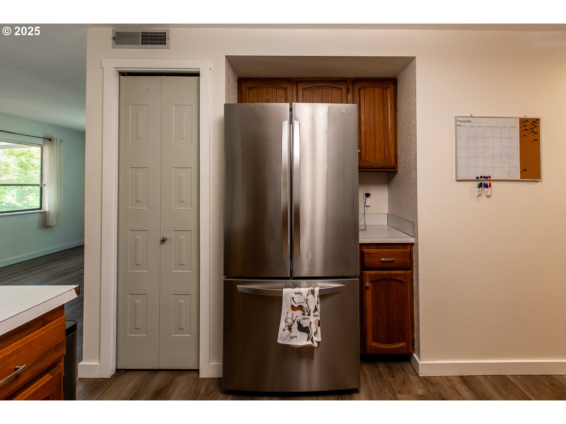 1403 Haven Street Eugene, OR 97402 - Photo 9 of 31 a kitchen with a refrigerator and cabinets