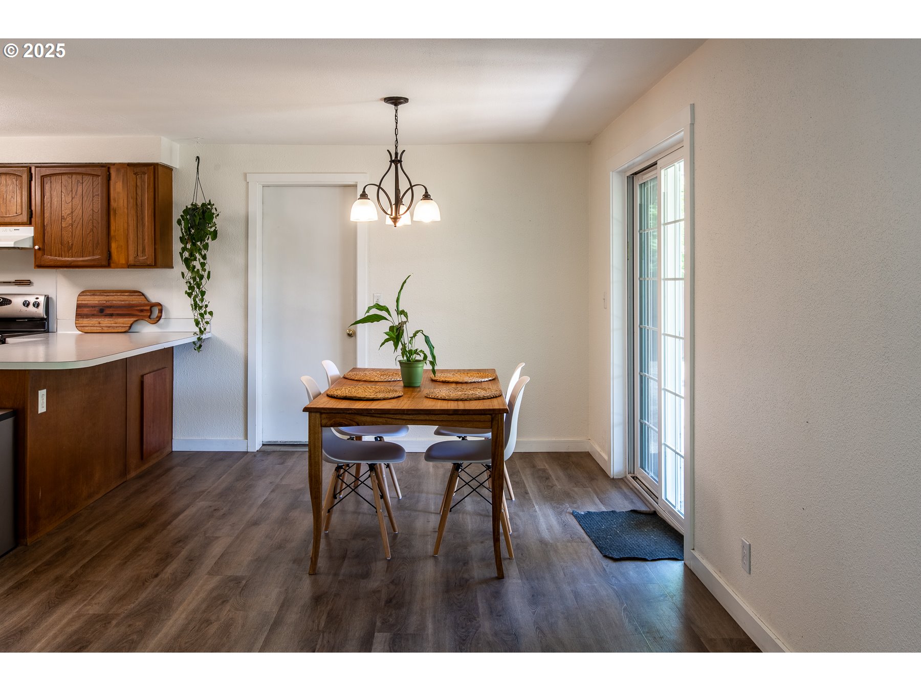 1403 Haven Street Eugene, OR 97402 - Photo 10 of 31 a view of a dining room with furniture and wooden floor