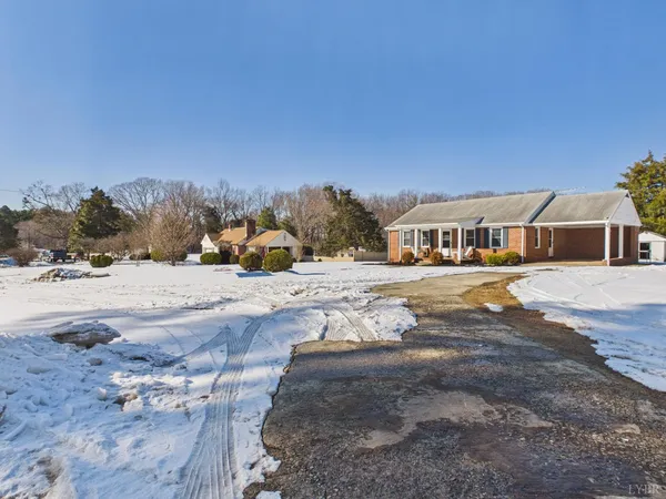 a view of roof and snow on the road