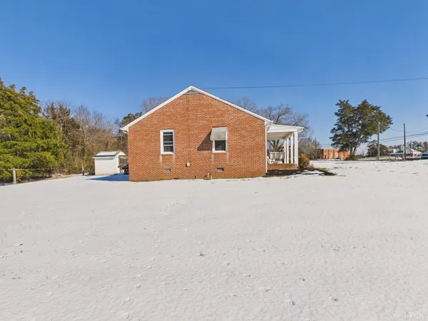 a view of a balcony with wooden fence and floor