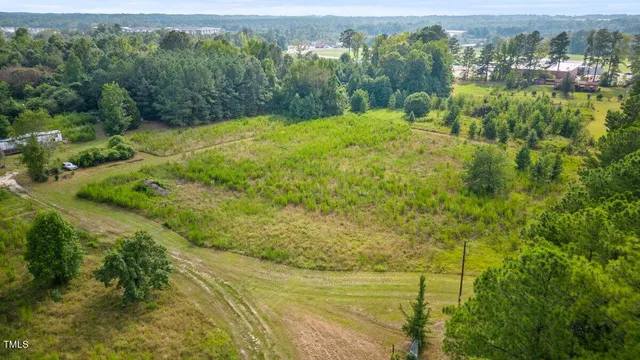 a view of a yard with an outdoor seating