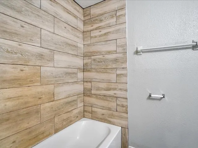 a bathroom with a bathtub