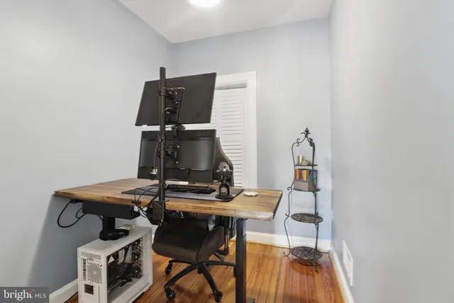 a workspace with furniture and wooden floor