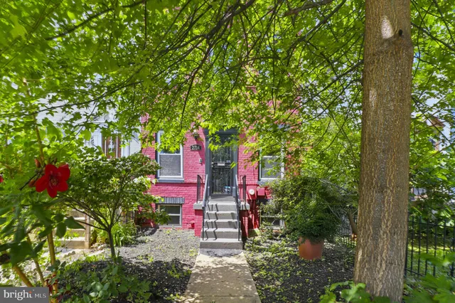 a front view of a house with yard