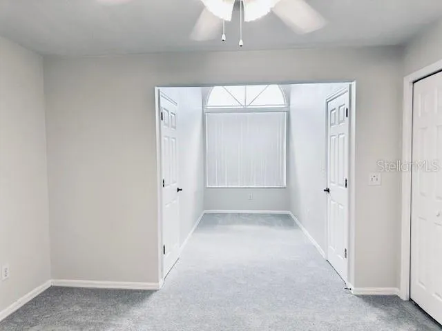 an empty room with a mirror