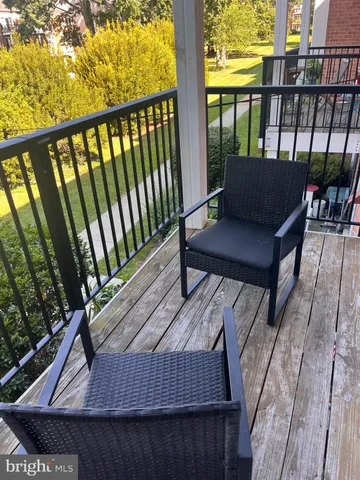 a view of balcony with furniture