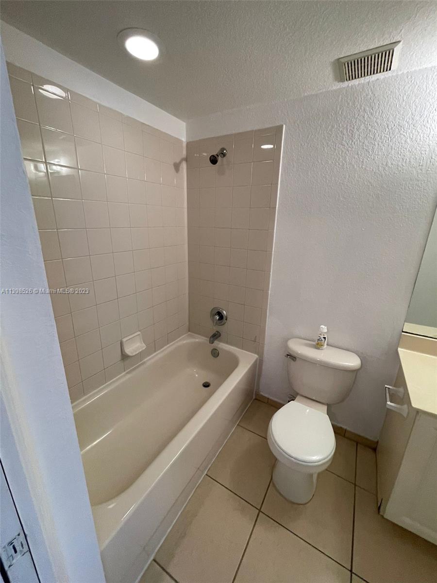 Riviera Beach Riviera Beach, FL 33404 - Photo 11 of 20 a bathroom with a sink a toilet a tub and a shower
