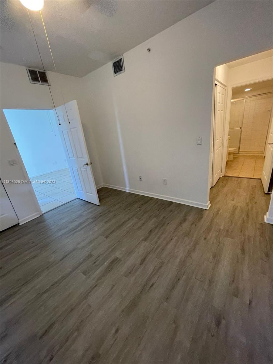 Riviera Beach Riviera Beach, FL 33404 - Photo 13 of 20 an empty room with wooden floor