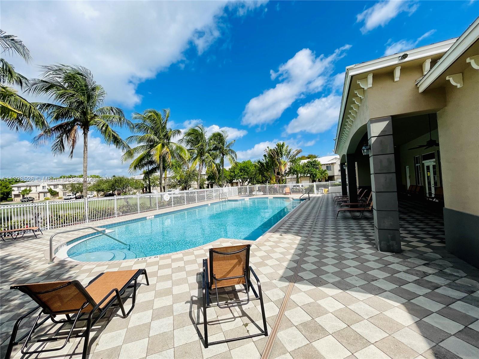 Riviera Beach Riviera Beach, FL 33404 - Photo 18 of 20 a view of swimming pool with chairs