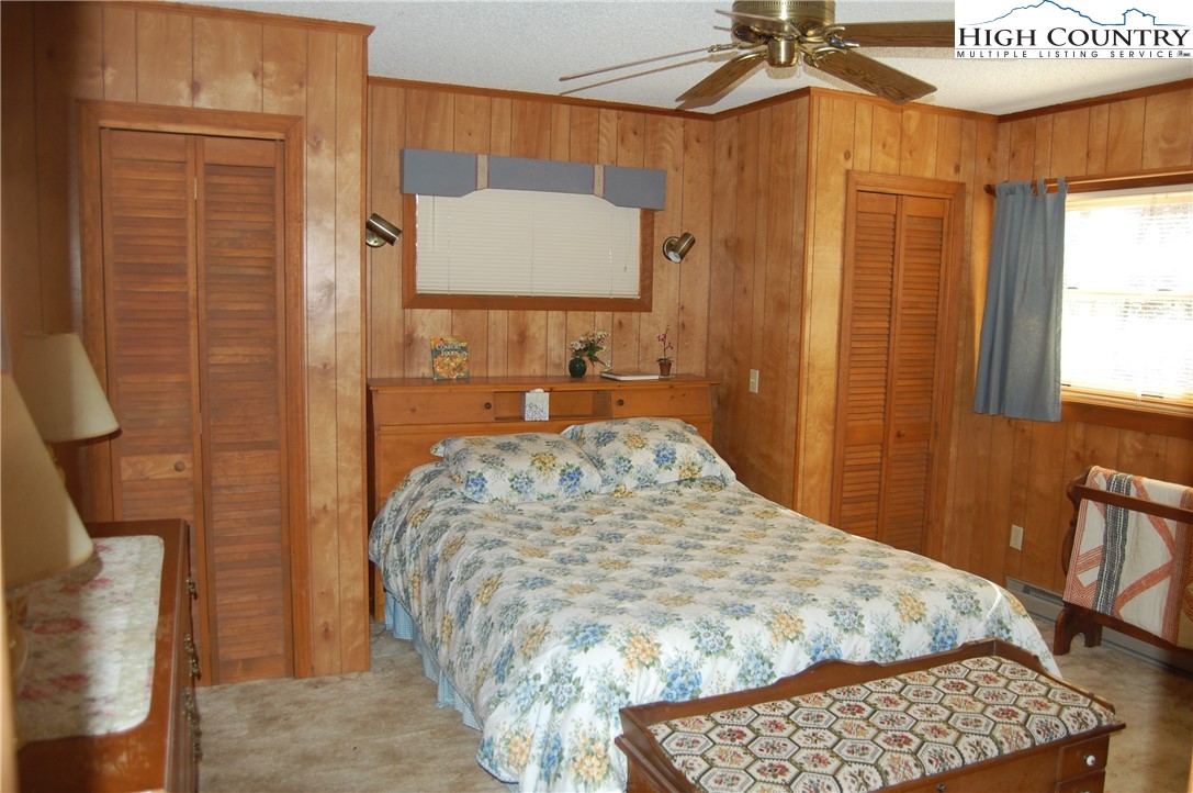 72 Robin Circle Newland, NC 28657 - Photo 11 of 24 a bedroom with a bed and a dresser