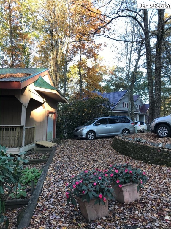 72 Robin Circle Newland, NC 28657 - Photo 22 of 24 a view of a garden with cars parked