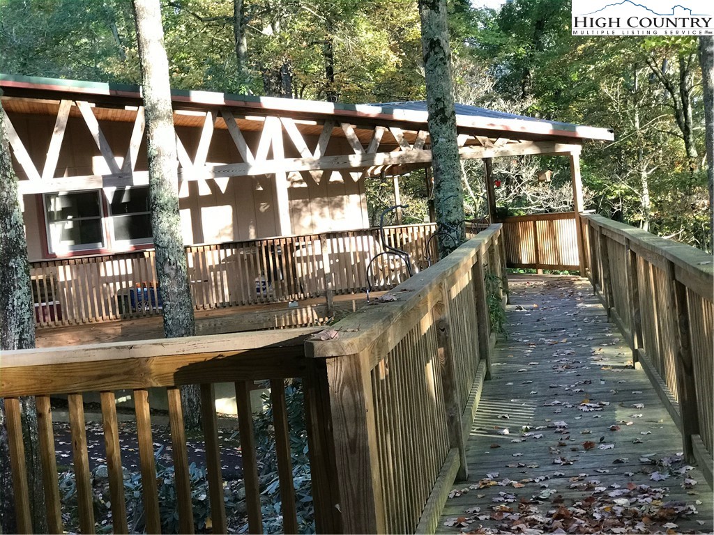 72 Robin Circle Newland, NC 28657 - Photo 23 of 24 a view of a house with backyard and deck