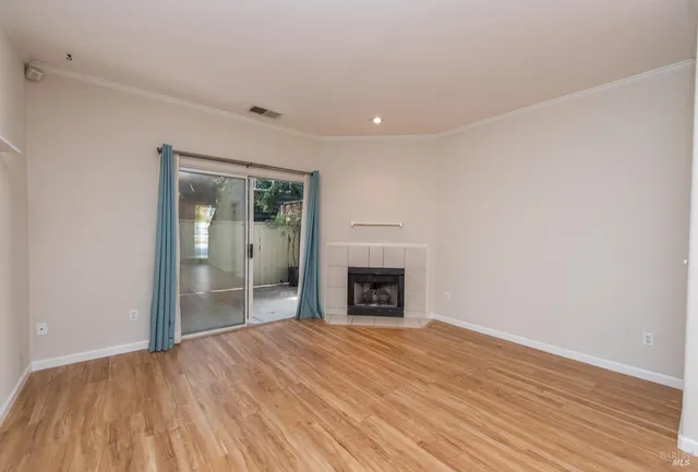 a view of a kitchen with a sink and a fireplace