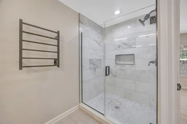 a bathroom with a sink and mirror with toilet