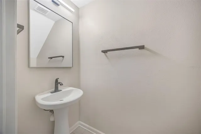 a white toilet sitting next to a white sink