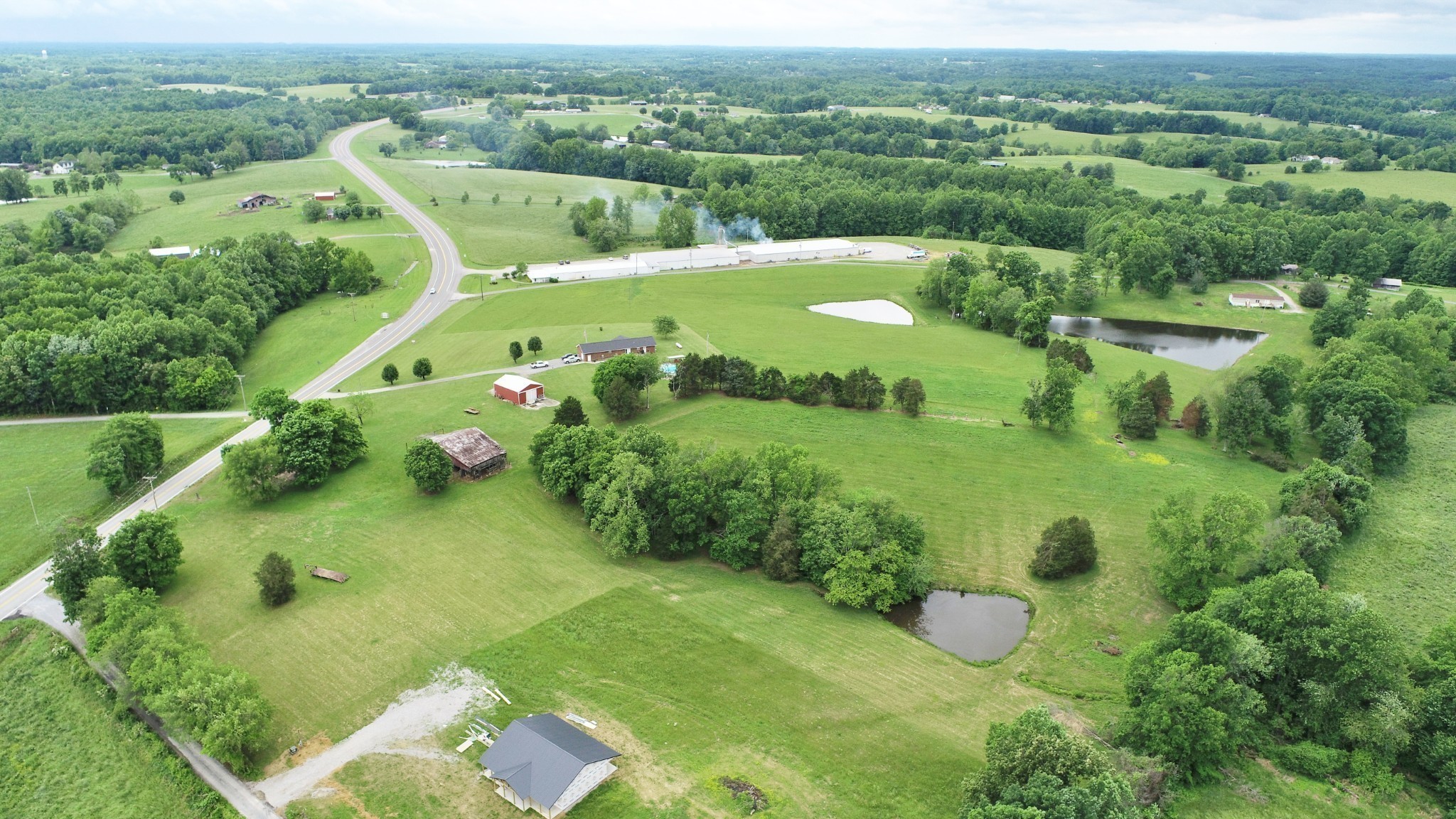 9 Willie Davis Road Red Boiling Springs, TN 37150 - Photo 3 of 8 a view of a city with lush green forest